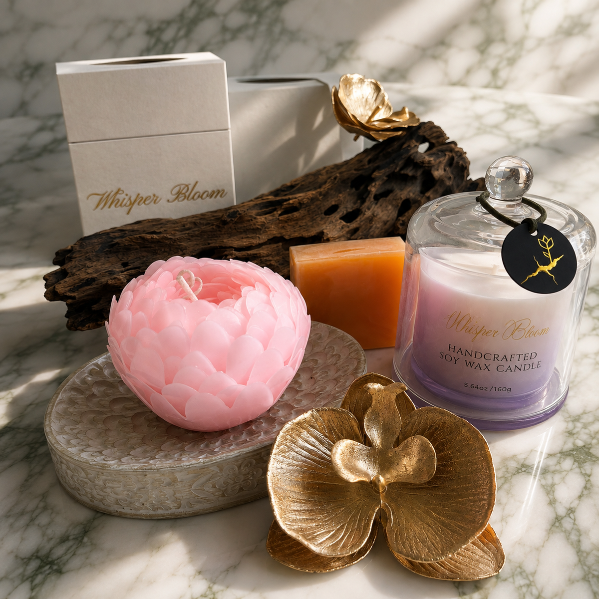 The Grace of Enduring Strength gift set with pink sculptural candle, purple cloche candle, and orange soap